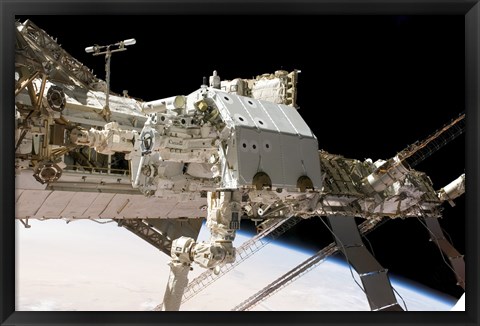 Framed Canadian-Built Dextre Robotic System in the Grasp of the Robotic Canadarm2 Print