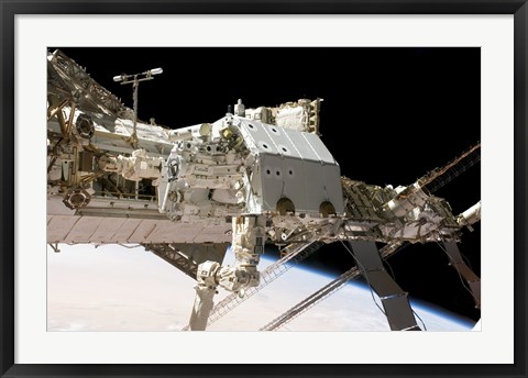 Framed Canadian-Built Dextre Robotic System in the Grasp of the Robotic Canadarm2 Print