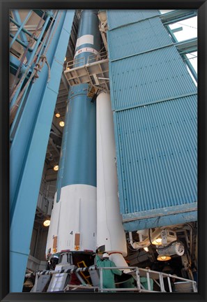 Framed Second Solid Rocket Motor is Moved into Place Alongside the Delta II First Stage Print