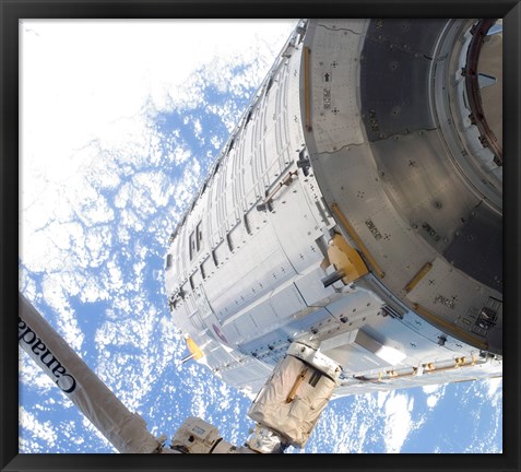 Framed Kibo Japanese Pressurized Module in the Grasp of the Robotic Canadarm2 Print