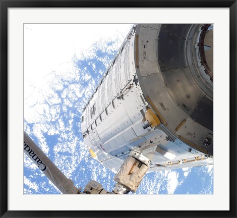 Framed Kibo Japanese Pressurized Module in the Grasp of the Robotic Canadarm2 Print