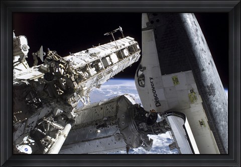 Framed Space Shuttle Discovery Docked to the International Space Station Print