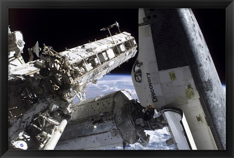 Framed Space Shuttle Discovery Docked to the International Space Station Print