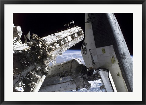 Framed Space Shuttle Discovery Docked to the International Space Station Print
