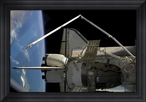Framed Soyuz Vehicle and the Space Shuttle Discovery Docked to the International Space Station Print