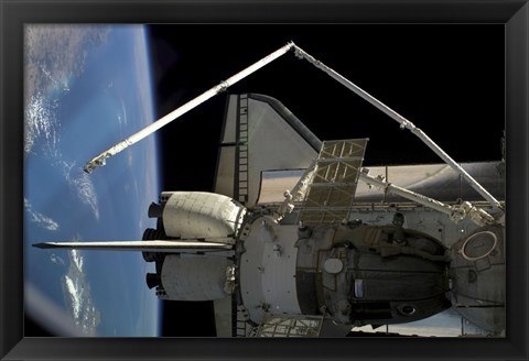 Framed Soyuz Vehicle and the Space Shuttle Discovery Docked to the International Space Station Print
