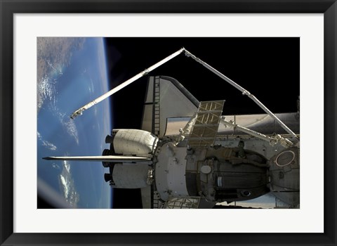Framed Soyuz Vehicle and the Space Shuttle Discovery Docked to the International Space Station Print