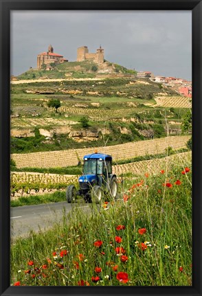 Framed Blue tractor on rural road, San Vicente de la Sonsierra Village, La Rioja, Spain Print