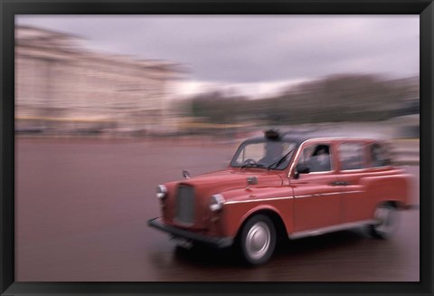 Framed Cab racing past Buckingham Palace, London, England Print