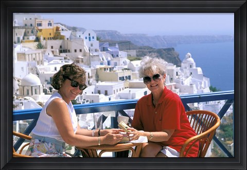 Framed Women Having Coffee on Cafe Terrace, Santorini, Greece Print