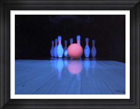 Framed Bowling ball with bowling pins Print