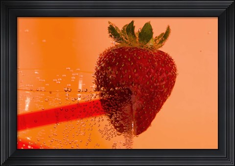 Framed Strawberry On Red Swirl Glass Print