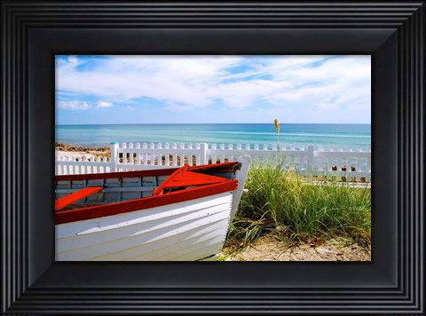 Framed Boat By The Beach Print