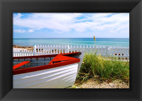 Framed Boat By The Beach Print