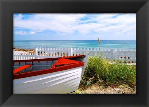 Framed Boat By The Beach Print