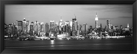 Framed Skyscrapers lit up at night in a city, Manhattan, NY Print
