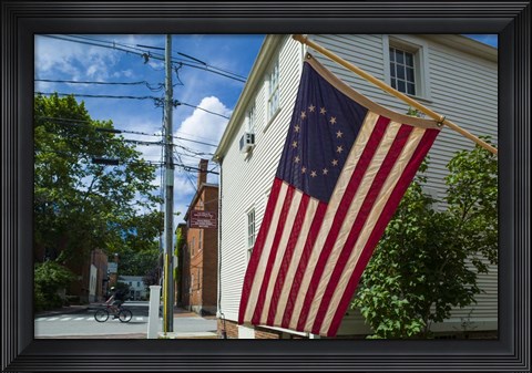 Framed New Hampshire, Portsmouth, Strawberry Banke Historic Area, building with US flag Print
