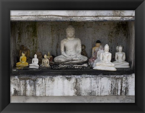 Framed Niche at Ruwanwelisaya Dagoba filled with Buddha statues as offerings, Anuradhapura, Sri Lanka Print