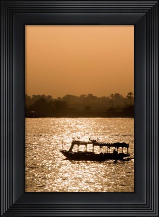 Framed Egypt, Luxor Water taxi at sunset Nile River Print