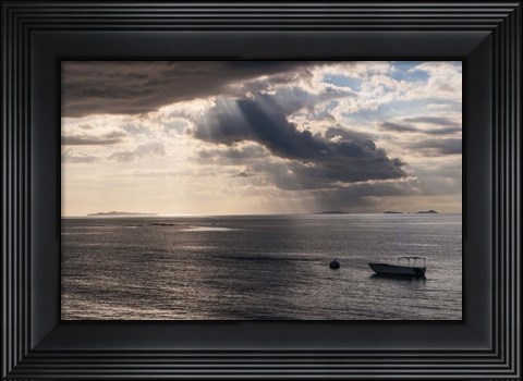 Framed Dramatic light over a little boat, Mamanucas Islands, Fiji, South Pacific Print