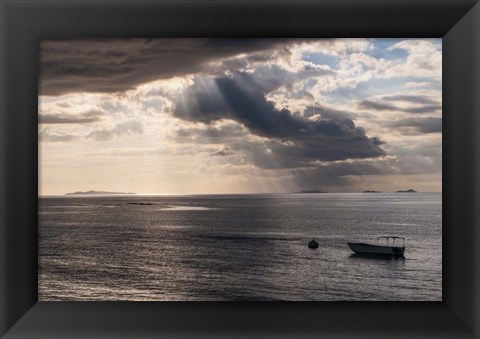 Framed Dramatic light over a little boat, Mamanucas Islands, Fiji, South Pacific Print