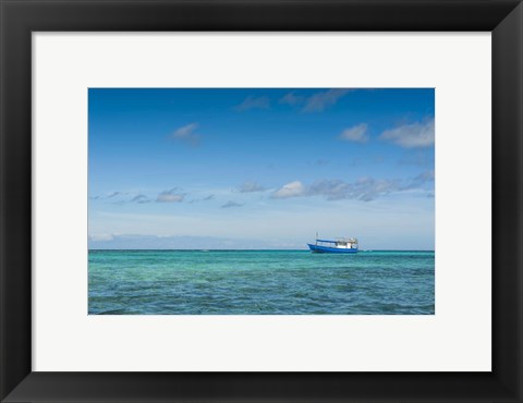 Framed Fishing boat in the turquoise waters of the blue lagoon, Yasawa, Fiji, South Pacific Print