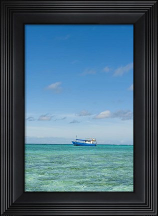 Framed Fishing boat in the turquoise waters of the blue lagoon, Fiji Print