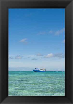 Framed Fishing boat in the turquoise waters of the blue lagoon, Fiji Print