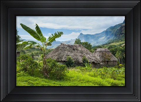 Framed Traditional thatched roofed huts in Navala, Fiji Print