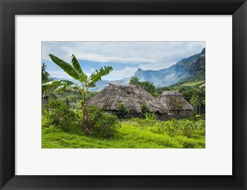 Framed Traditional thatched roofed huts in Navala, Fiji Print