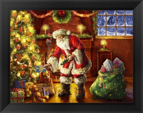 Framed Santa putting gifts under tree Print