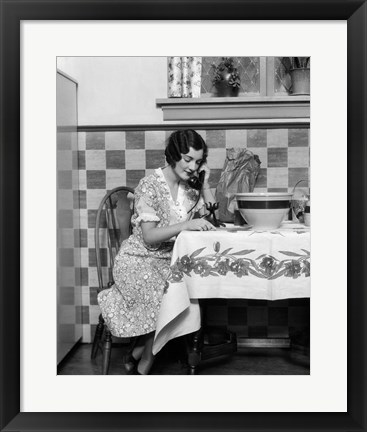 Framed 1920s Woman Sitting At Kitchen Table Print