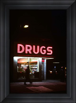 Framed 1980s Drug Store At Night Pink Neon Sign Print
