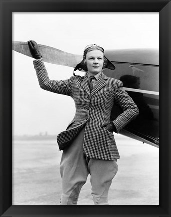 Framed 1930s Woman Aviator Pilot Standing Next To Airplane Print