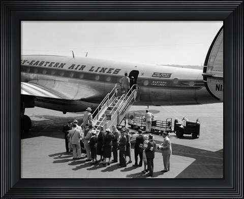 Framed 1950s Group Of Passengers Boarding Airplane Print