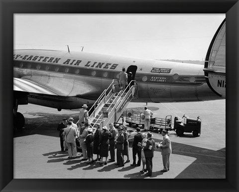 Framed 1950s Group Of Passengers Boarding Airplane Print