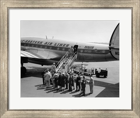 Framed 1950s Group Of Passengers Boarding Airplane Print