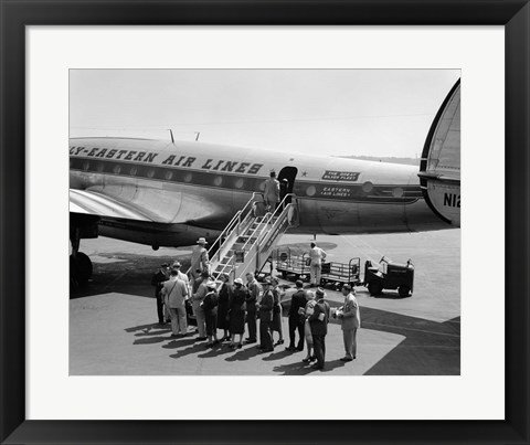 Framed 1950s Group Of Passengers Boarding Airplane Print