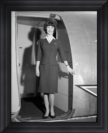 Framed 1960s Smiling Stewardess Standing In Doorway Print