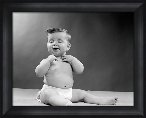Framed 1950s Baby Seated With Eyes Closed Print