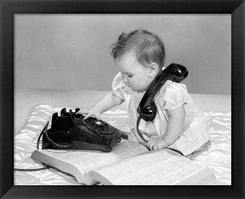 Framed 1960s Baby Girl With Telephone Book Print