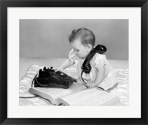 Framed 1960s Baby Girl With Telephone Book Print