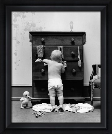 Framed 1940s Toddler Baby Pulling Clothes Out Of Bureau Print