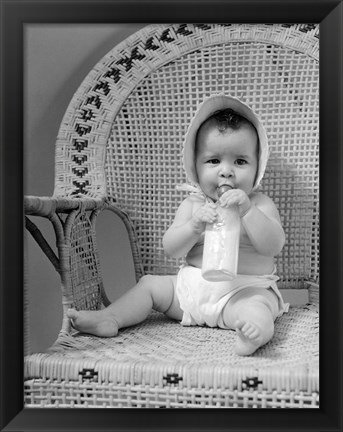 Framed 1940s Baby Sitting In Wicker Chair Print