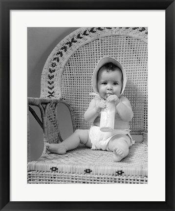 Framed 1940s Baby Sitting In Wicker Chair Print