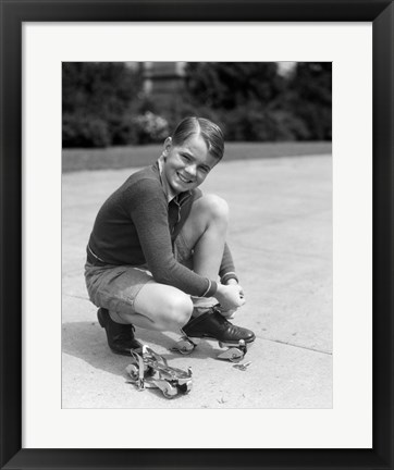 Framed 1930s Smiling Boy Fastening On Metal Roller Skates Print