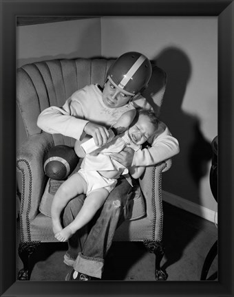 Framed 1950s 1960s Boy Sitting By Football Print