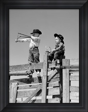 Framed 1950s Two Young Boys Dressed As Cowboys Print