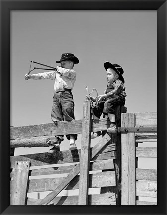 Framed 1950s Two Young Boys Dressed As Cowboys Print