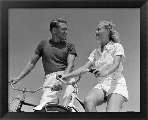 Framed 1930s 1940s Smiling Couple On Bikes Looking At One Another Print
